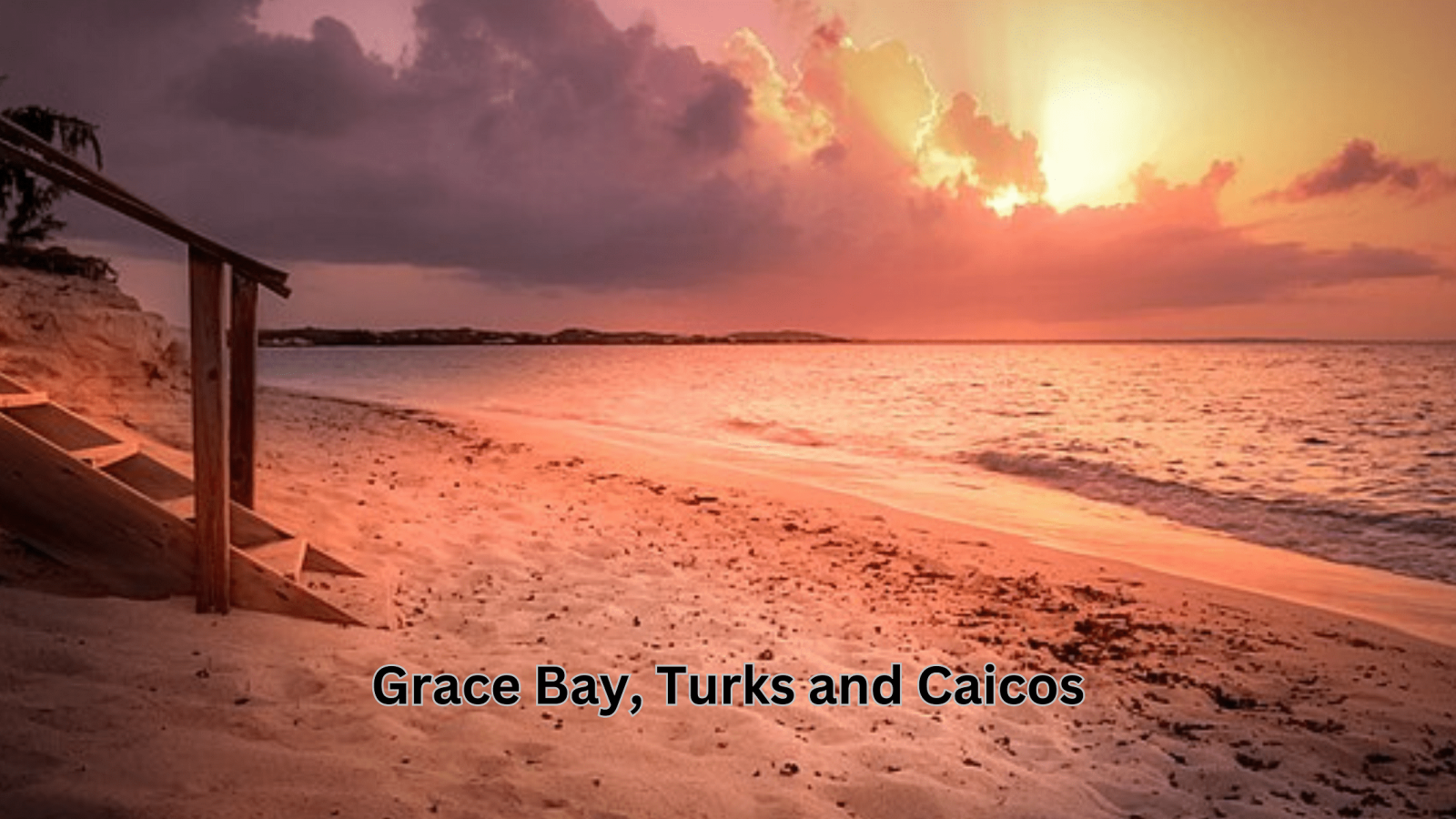 Aerial view of Grace Bay, Turks and Caicos, featuring turquoise waters and white sandy beach.