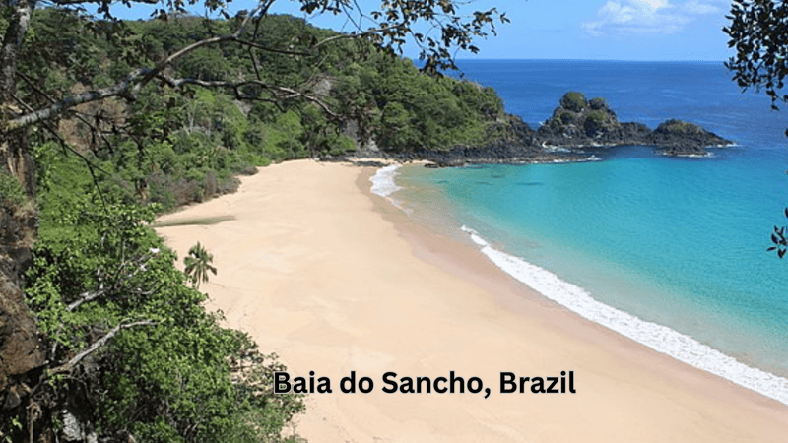 Baia do Sancho in Brazil, featuring emerald waters and a golden sandy beach.